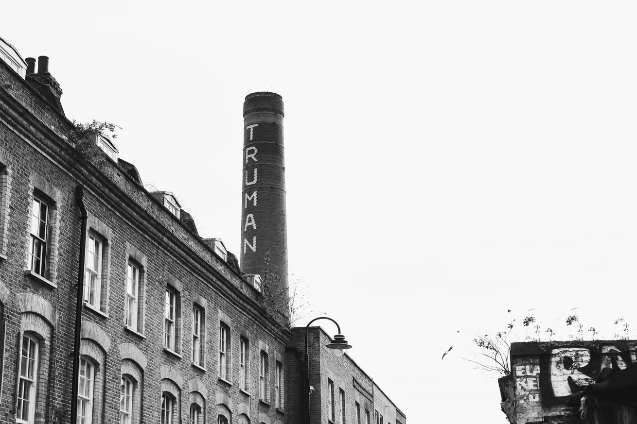 Black and white photograph of the Truman Brewery chimney on Brick Lane, London, by Rachel Groom Photography.